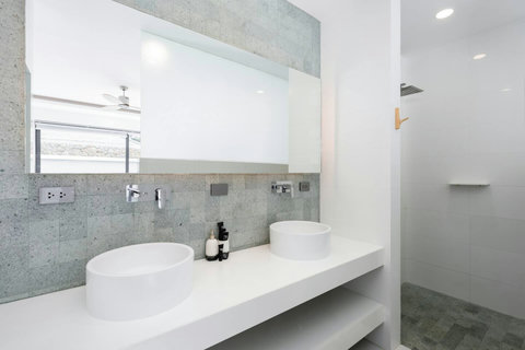 Elegant bathroom with standalone tub and glass shower Villa Jasmine Koh Samui luxury villa Thailand spa bathroom