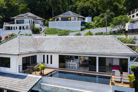 Modern hillside villa with private pool surrounded by lush Koh Samui jungle.