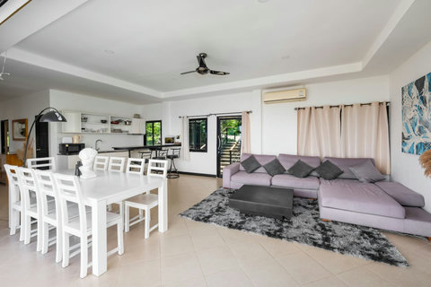 Bright indoor dining and living space with direct access to the pool terrace