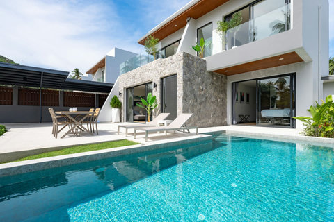 Crystal-clear private pool with villa views and outdoor lounging area at Villa Solaria