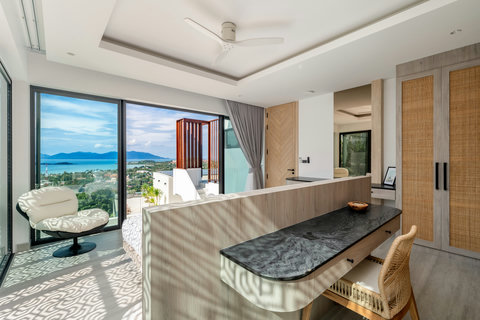 Light-filled living area with soaring ceiling and ocean panorama