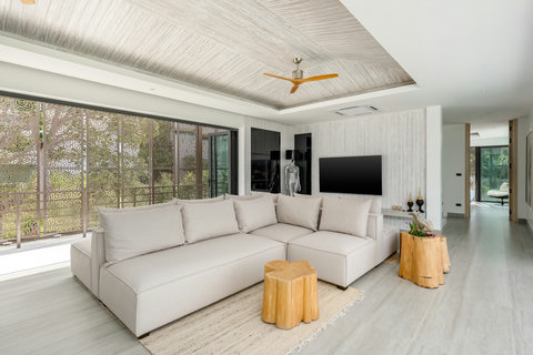 Modern lounge area with sleek minimalist furniture and wood accents