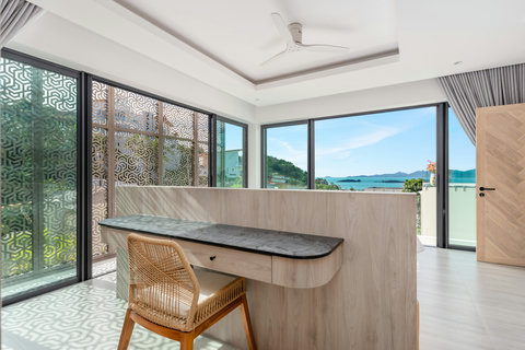 Open-plan living area with floor-to-ceiling ocean views