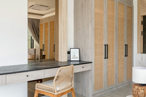 Modern kitchen with breakfast bar and designer pendant lights