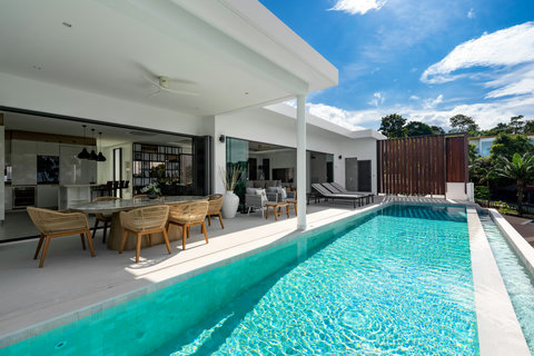 Crystal-clear private pool with sea views and blue skies