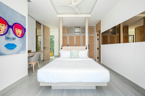 Bright bedroom with artistic decor and garden views