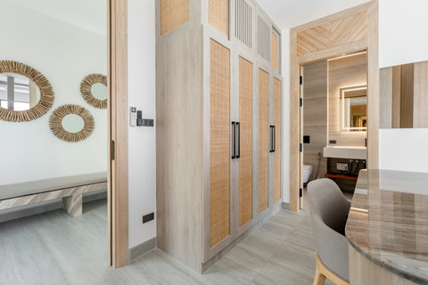 Welcoming villa entrance with decorative wooden doors