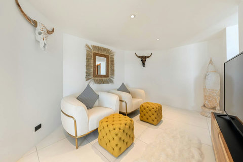 Elegant bedroom with contemporary decor and stylish yellow accent poufs - Villa Caprice 5-bedroom luxury retreat Santi Thani Bangpor Koh Samui