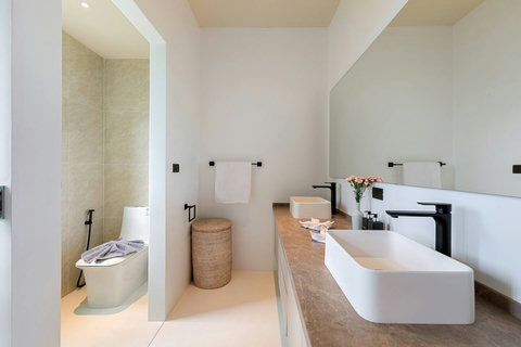 Modern ensuite bathroom with freestanding bathtub natural wood vanity and spa-like amenities - Villa Caprice 5-bedroom luxury retreat Santi Thani Bangpor Mae Nam Koh Samui