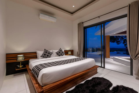 Romantic bedroom at sunset with ocean terrace access and luxurious bedding - Villa Caprice 5-bedroom luxury retreat Santi Thani Bangpor Mae Nam Koh Samui