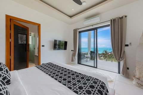 Stunning master bedroom with king bed panoramic ocean terrace and elegant contemporary design - Villa Caprice 5-bedroom luxury retreat Santi Thani Bangpor Mae Nam Koh Samui