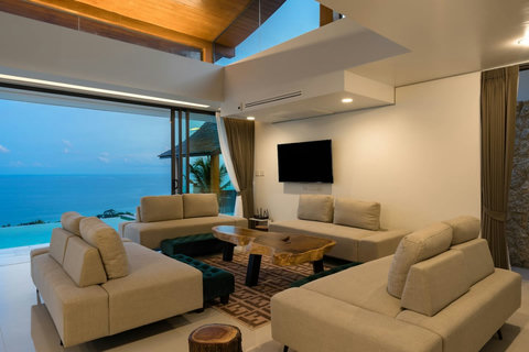 Comfortable living room at Villa Ariya Koh Samui - Relaxing lounge with panoramic ocean views through glass doors