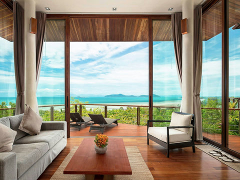 Spacious open-plan living area with floor-to-ceiling windows and stunning ocean panorama at Villa Soluna Koh Samui