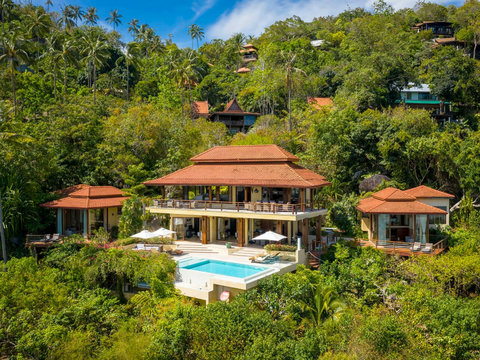 Aerial view of Villa Soluna compound nestled in tropical hillside with traditional thatched roofing - Koh Samui