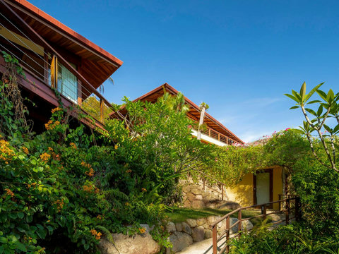Villa Soluna nestled among tropical gardens with coconut palms and exotic vegetation in Koh Samui
