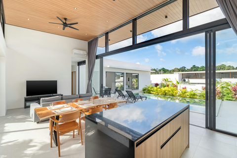 Living & Dining Area - Open Plan Design with Pool Views & Modern Furnishings