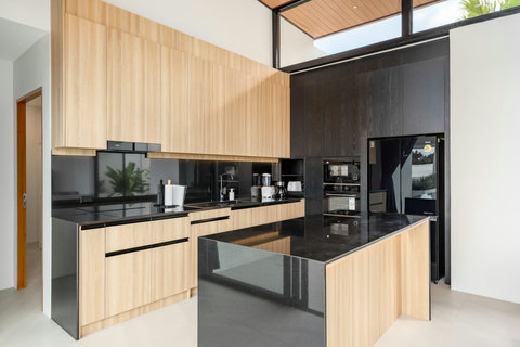 Designer Kitchen - Black Island, Wood Cabinets & Modern Appliances