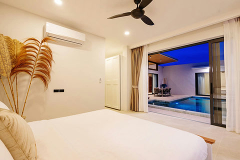 Bedroom with ceiling fan and dusk pool views through sliding glass doors