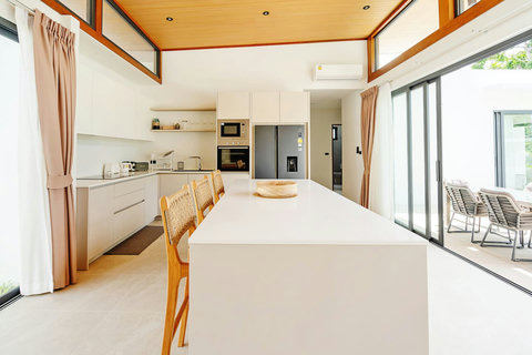 Modern kitchen with island, bar seating and premium appliances