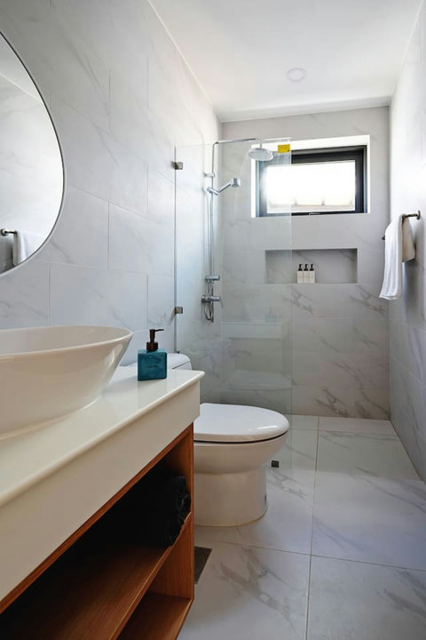 Luxurious ensuite bathroom - Freestanding bathtub, rain shower, and elegant marble finishes
