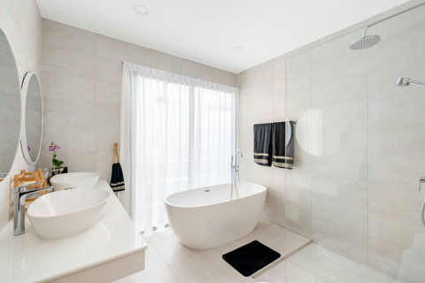 Luxurious white bathroom with modern soaking tub