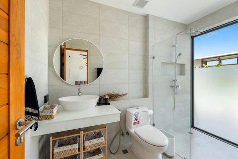 Step into the rainfall shower and let the day wash away — this bathroom feels like a personal spa