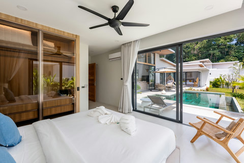 Stylish master bedroom with artisan headboard and ceiling fan, Bophut villa rental
