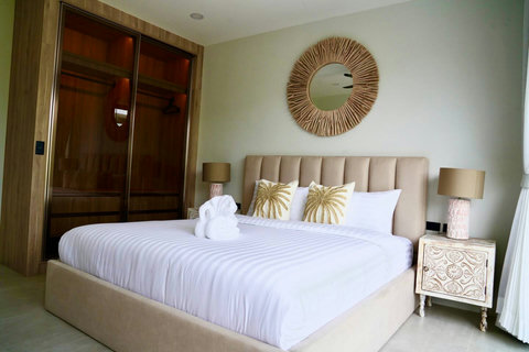 Elegant master bedroom in Koh Samui luxury villa with king bed and ensuite bathroom
