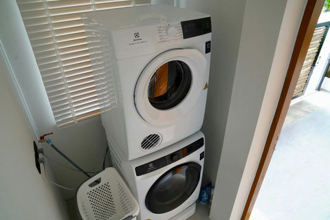 In-villa laundry facilities in Koh Samui vacation rental with modern appliances