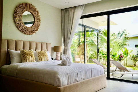 Bright bedroom with tropical garden and pool views in Bophut Samui vacation villa