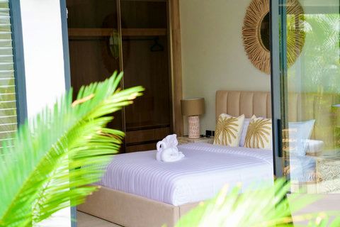 Serene guest bedroom in Koh Samui rental with direct garden access and natural light