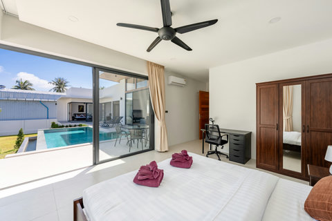 Spacious lounge area with contemporary design, ambient lighting, entertainment zone, and indoor-outdoor connectivity