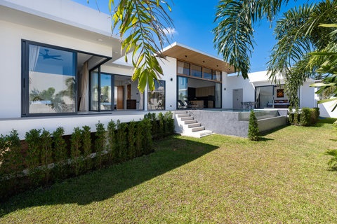 Your private sanctuary: lush gardens, clean architecture, and the peace and quiet only a villa can offer.