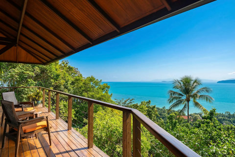 Breathtaking panoramic terrace at Bang Kao villa with Koh Tan island views tropical palm tree and sunset vistas