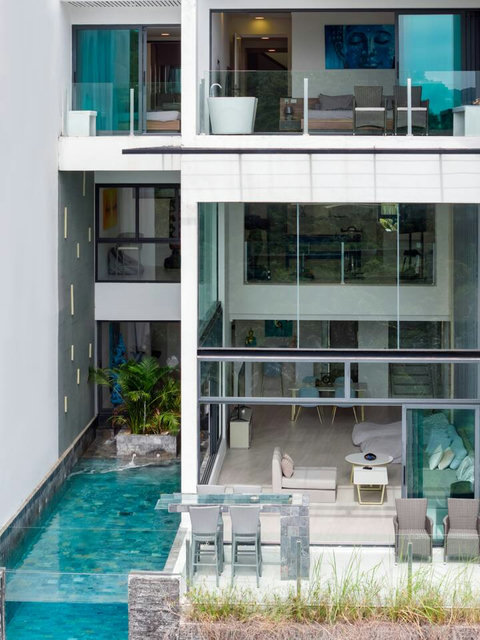 Contemporary glass facade villa exterior at Villa J3, Replay Residence Bangrak Koh Samui