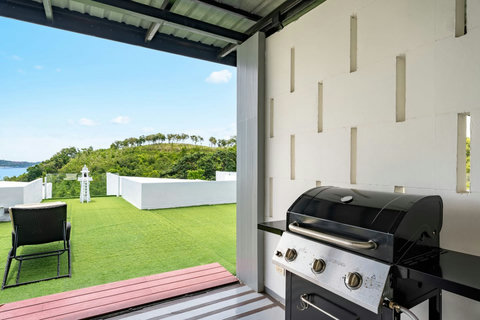 Outdoor garden terrace with tropical landscaping at Villa J3, Replay Residence Bangrak Koh Samui