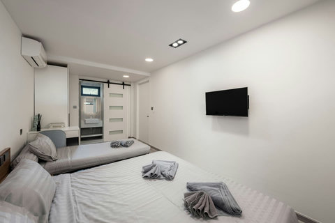 Comfortable guest bedroom with modern decor at Villa J3, Replay Residence Bangrak Koh Samui