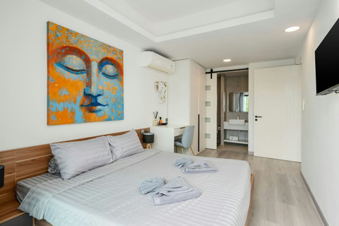 Tropical garden with pool deck at Villa J3, Replay Residence Bangrak Koh Samui