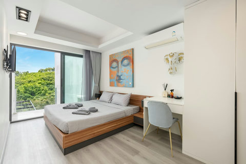 Bedroom with pool and sea views at Villa J3, Replay Residence Bangrak Koh Samui