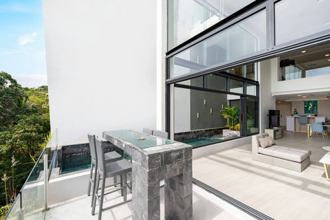 Modern villa exterior with balconies and pool at Villa J3, Replay Residence Bangrak Koh Samui