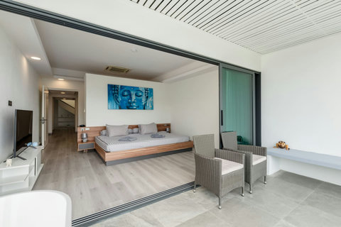 Bedroom with glass-enclosed ensuite bathroom at Villa J3, Replay Residence Bangrak Koh Samui