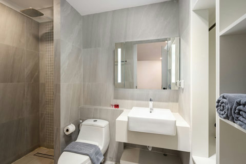 Clean white bathroom with modern fixtures at Villa J3, Replay Residence Bangrak Koh Samui