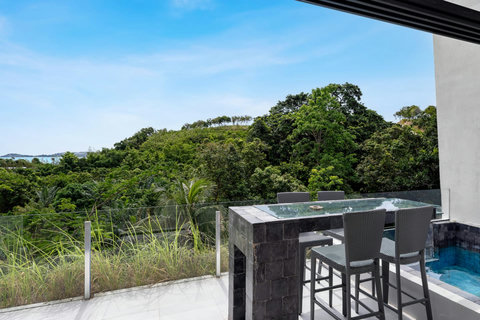 Tropical garden terrace with ocean views at Villa J3, Replay Residence Bangrak Koh Samui