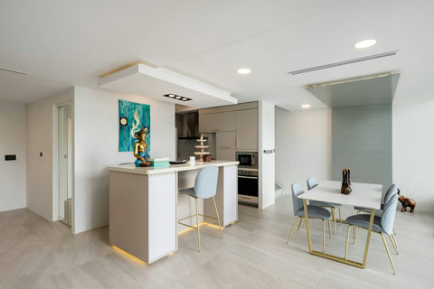 Living and dining area with terrace access at Villa J3, Replay Residence Bangrak Koh Samui