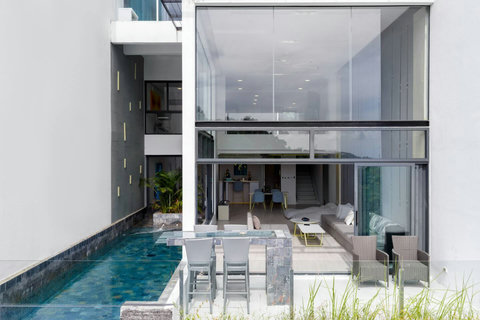 Entrance hallway with pool views at Villa J3, Replay Residence Bangrak Koh Samui