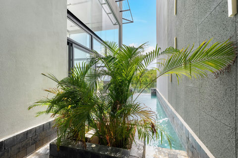Tropical balcony terrace with lush greenery at Villa J3, Replay Residence Bangrak Koh Samui