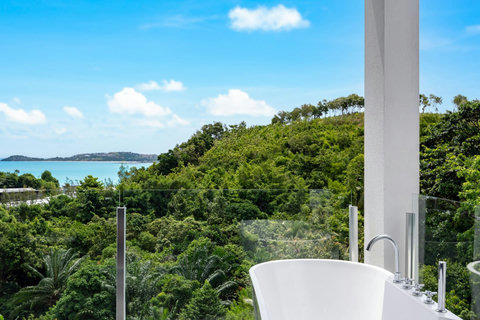 Scenic sea view balcony with tropical hillside at Villa J3, Replay Residence Bangrak Koh Samui