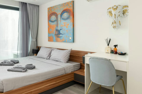 Elegant guest bedroom with wall art at Villa J3, Replay Residence Bangrak Koh Samui