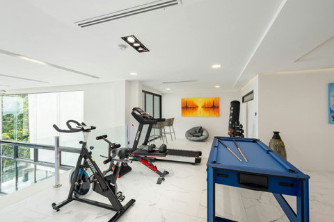 Recreation room with gym equipment and ping pong at Villa J3, Replay Residence Bangrak Koh Samui