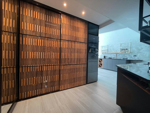 Modern entrance with wooden slat design at Villa Q1, Replay Residence Bangrak